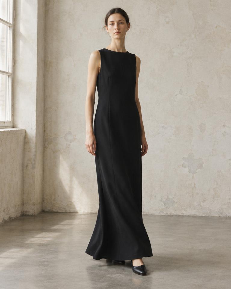 Model wearing the ankle-length Column Dress in black twill
