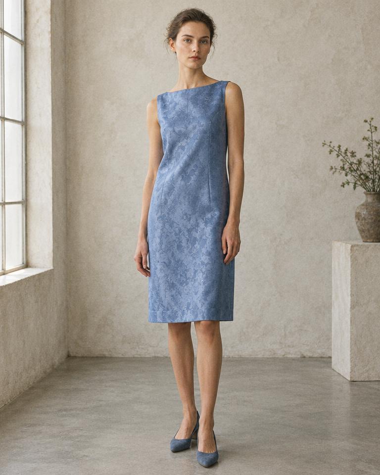 Model wearing the sleeveless Shift Dress in blue jacquard