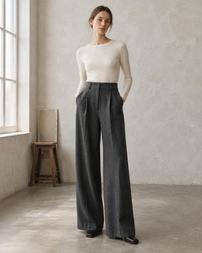 Model wearing the high-waisted Wide Trouser in charcoal wool