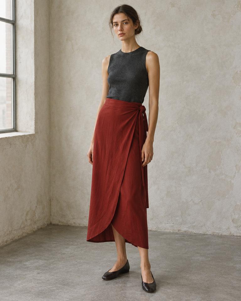 Model wearing the asymmetric Wrap Skirt in deep red viscose